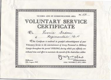 Photocopy of a voluntary service certificate issued by the Victoria Line of Communications Area to Leonie Dadson of “Regimentals C.P.” for voluntary service in the entertainment of Army Personnel in military camps throughout 1939/1945. Dated Melbourne 15th August 1945 and signed by J. Whitelaw