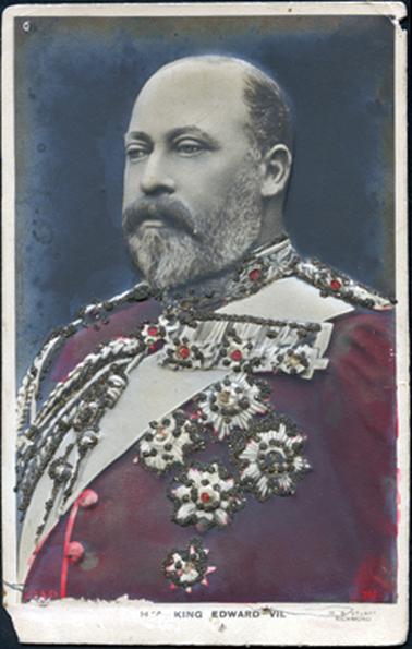 This image shows a colourized, embossed portrait of King Edward VII wearing a red uniform with medals and decorations.  A wide sash is across his chest from shoulder to waist.  The embossed sections on his uniform have been picked out with glitter.  Printed on the mounting at the bottom is “H M KING EDWARD VII.”.  In tiny red printing at the bottom left-hand side of the photograph is: “J B & Co” and on the right-hand side is the number “761”.  In tiny printing on the right-hand bottom of the mount is “W.S. Stuart Richmond”.