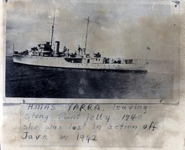 This image is a copy of a photograph of a ship.  The ship has two tall masts and a flag is flying from a pole at the stern. A large funnel is between the masts.  Printed beneath the photo of the ship is:  “HMAS YARRA leaving Stony Point jetty 1940 she was lost in action off Java in 1942”.