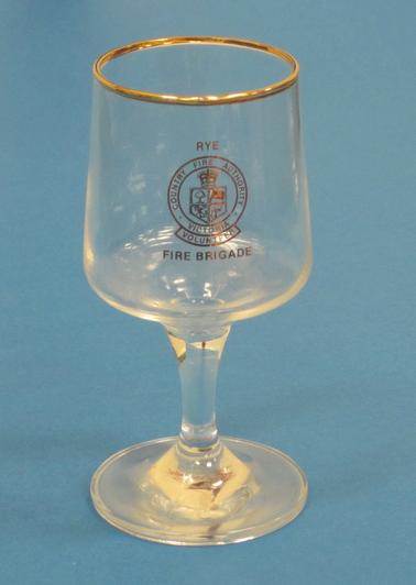 Wine glass with “County Fire Authority Victoria Volunteer” logo and badge  in gold print. “RYE” above and FIRE BRIGADE” below.