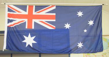 Australian flag with fittings for hanging.