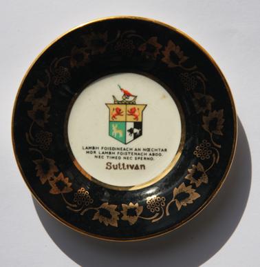Black and gold leaf dish with Sullivan Crest.  Inscription in Gaelic.  Translation: “The gentle hand to Victory Neither fear nor condemn”