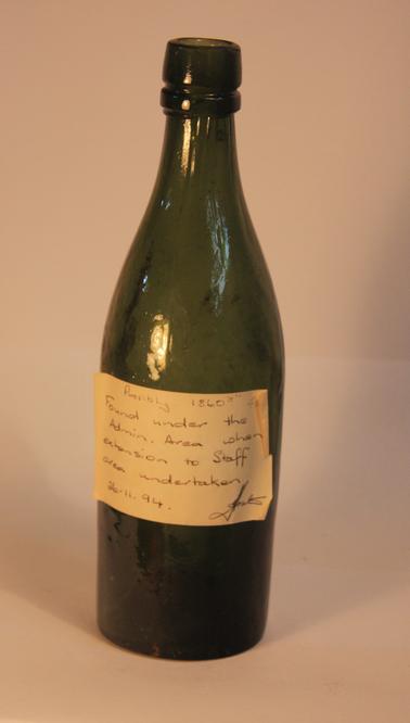 Dark green glass bottle