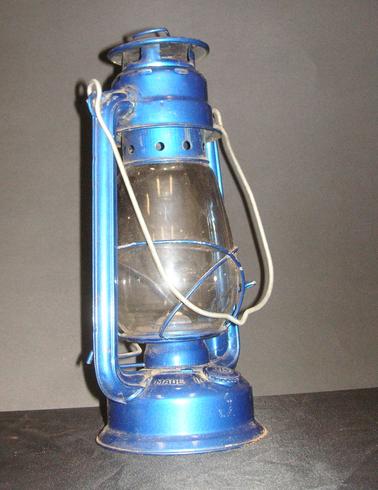 Blue painted metal and glass lantern with handle.