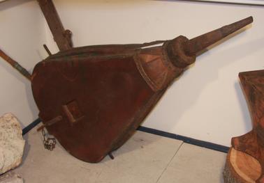 3-way action bellows.  Leather, wood and steel construction.