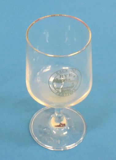 Wine glass with Rye Logo and “Back to Rye Fesitval 1981” in gold lettering
