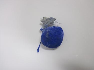 Used cylindrical block of laundry “blue”.  Before use - wrapped in cream paper with red stripes.  Text across paper - “Reckitts Bag Blue - Remove label, wrap block in flannel - and stir in the last rinse”