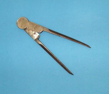 Compass dividers made of metal.  Used for plans and maps