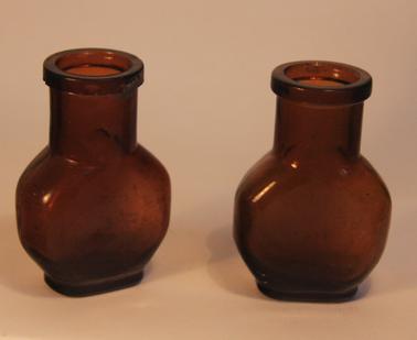 2 Dark brown glass bottles 