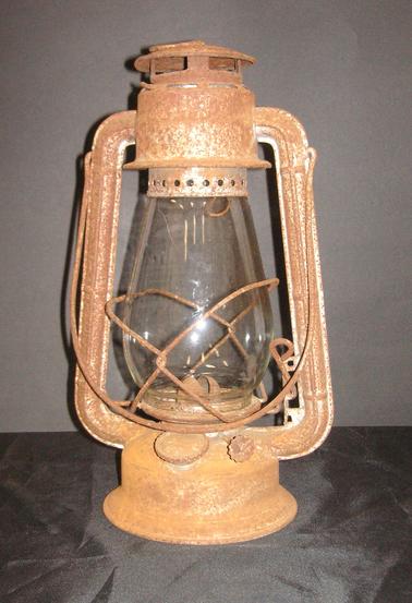 Metal and glass lantern with handle.  Originally painted silver.
