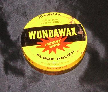 Round “Wundawax” floor polish tin with some wax inside.  Lid yellow with black and red printing.  Net weight 4oz