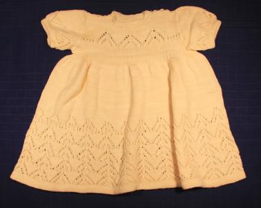 Cream woollen knitted dress with short sleeves