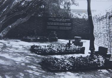 Three early settlers graves with brick walls on two sides Inscription reads " Sorrento birthplace of Victoria Early Settlers graves" with description