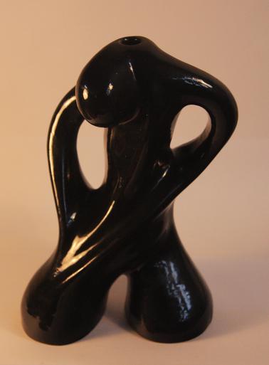 Pottery lamp base with black glaze.  Stylised figure.