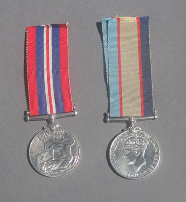 2 war service medals attached with bars and ribbons. War medal has George VI front and lion and eagle on reverse.  Australian Service medal has George VI on front and Australian Coat of Arms on reverse.  Contained in cardboard box with L. Arnold and number 90259 written on.