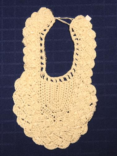 White silk/cotton crocheted baby bib