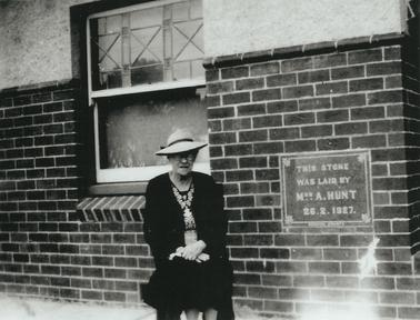Mrs Hunt (owner of hotel) beside foundation stone - Rye Hotel