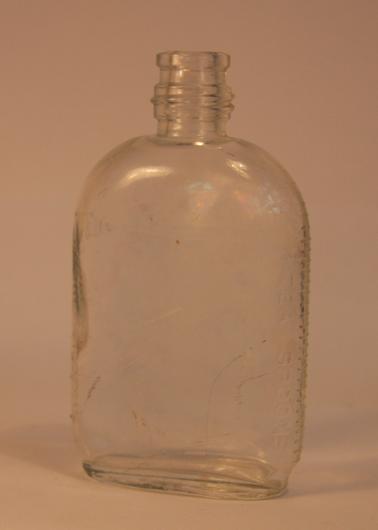 Clear glass - original type “Dettol” bottle.  Teaspoon and tablespoon graduations on sides.
Screw cap missing 