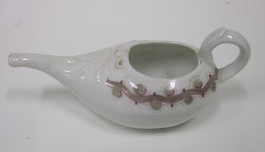 White china invalid cup with spout and handle, decorated with brown and purple design.