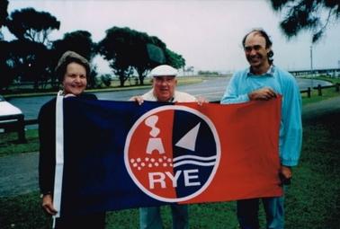 Photo of Rye flag with initiator (Pauline Powell); designer (Ron Tuckerman) and producer (Kim Bensley)