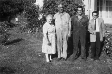 Group photo of four people, a woman and three men.