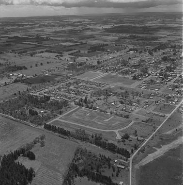 Aerial photograph of a coastal town.