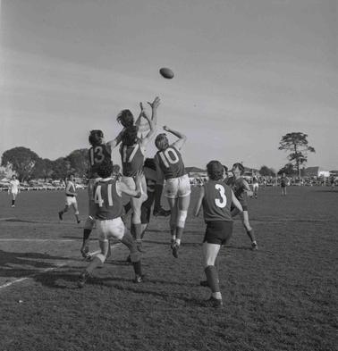Five footballers at play.