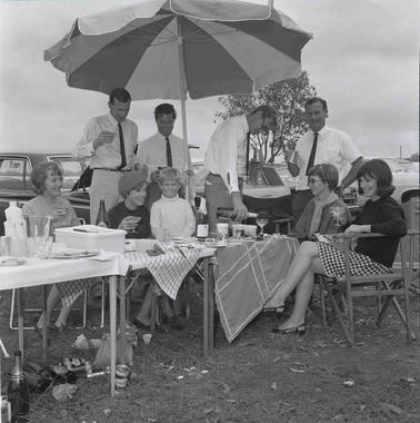 Group photograph of people at a picnic.