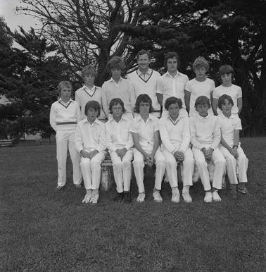 QA tableau of twelve junior cricketers with their coach.