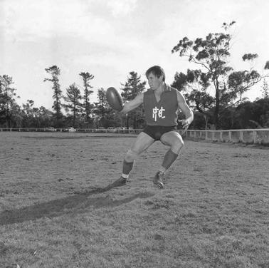 A footballer running.