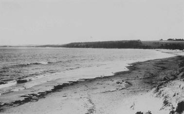 Merricks Beach, looking towards Point Leo. Beach on right side of photo. Headland across centre of photo.