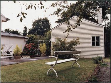 The schoolhouse at Southdene Mornington, which is weather board, with one chimney and a small window on  the right