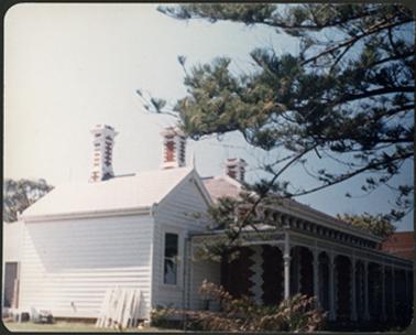 ‘Garycloyne’ is a brick residence with a white weather board addition on left side an ornate wrought iron verandah and three brick two tone chimneys two tone detail at corners and window surrounds