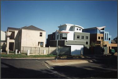 3 houses Cnr. Barkly St and Beleura Hill Road 
1. 2 story stucco, grey tiled roof
2. 3 story stucco, garage beneath curved roof
3. 3 story stucco, split levels, angled roof
