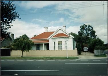 Edwardian weatherboard double fronted with bay window iron roof, 2 chimneys, scalloped barge board