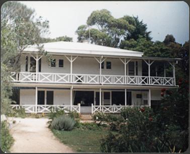 Two storey American plantation style weather board house with verandah surround