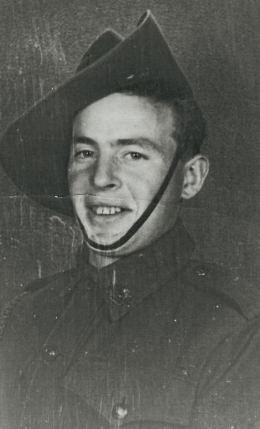 Head and shoulders photo of Soldier in WW2 Army uniform.  