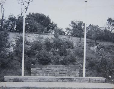 Stone Wall depicting site of lst Settlement at Port Phillip in 1803/1804. Flagpole on either side.