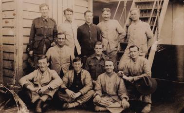 1. Group of soldiers (in uniform) Henry Tayton 2nd row seated, 1st on left
2. Enlargement of postcard, signature of men on reverse, “S S Shropshire 05.05.19” H Tayton first onleft front row.