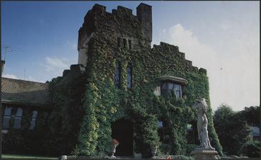 Calendar photograph c1914-19, cassellated, towered and large stuccoed Tudor revival summer house, ivy covered, similar style to Castle Delgany, Portsea