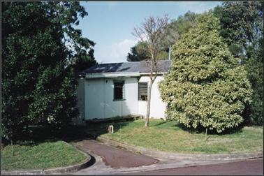The photo shows the rear of ‘Craigie Lea’, fibro sheds abutting with louvre windows