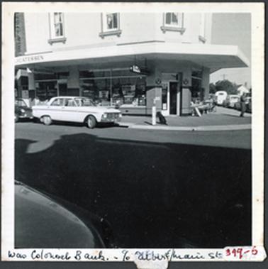 A corner shop, two storey four upper storey windows showing with original sills full glass windows to lower section verandah out to street level 