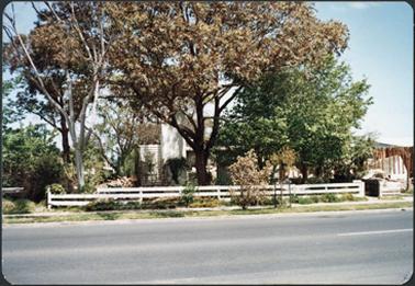 A frontal view of the residence of Leslie Moorhead who lived in Main Street, Mornington, the house was a white weatherboard construction with a white wooden fence