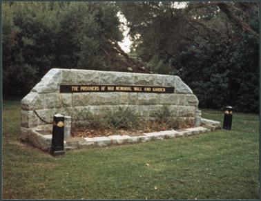 A side on view of the Prisoner of War Memorial Garden and Wall in Memorial Park situated at the corner of Albert and Barkly Streets, Mornington. Erected April 1987