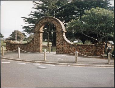 Front view of the Mornington Park gateway entrance situated on the corner of the Esplanade and Schnapper Point Drive, Mornington the gateway is constructed of stone and in the shape of an arch