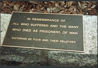 A plaque in the Prisoner of War Memorial Gardens, Memorial Park, corner Albert and Barkly Streets, Mornington, which reads: "In remembrance of all who suffered and the many who died as prisoners of war - Victorian Ex POW and their relatives"