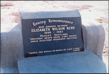A rectangular shaped dark marble head stone marking the grave of Elizabeth Wilson Kerr, the inscriptions are inlaid with gold