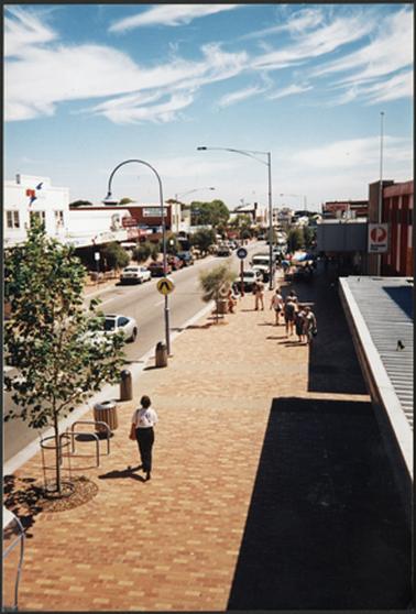 View of the Main Street, Mornington, looking Northwards from the Grand Hotel. Brick footpath features prominently