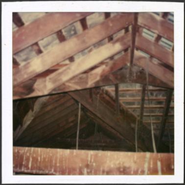 A photo of the framework of the inside of the roof of the Old Post Office Museum