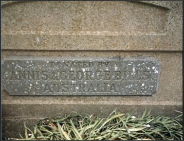 A front close up view of the horse trough which is situated on the Esplanade in Mornington the image consists of the text engraved on the stone plaque attached to the trough the trough was donated by Annis & George Bills
